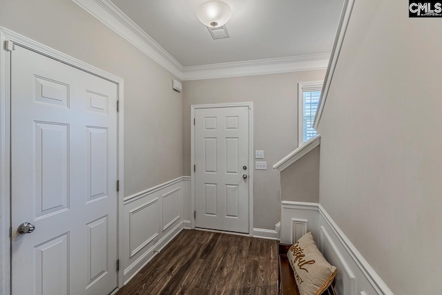 entryway featuring crown molding and dark hardwood / wood-style floors