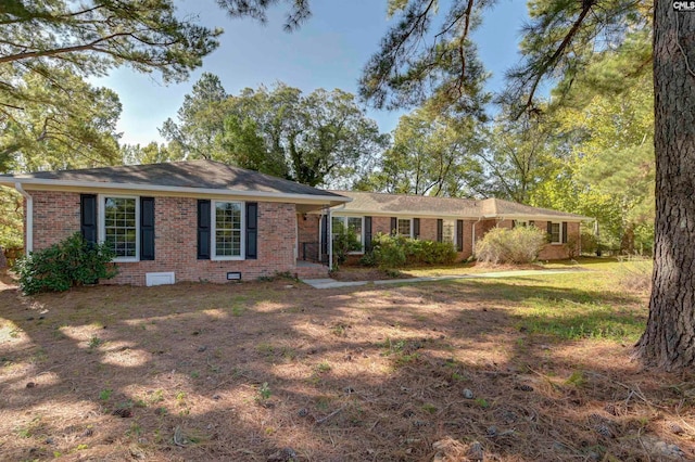 ranch-style house with a front lawn