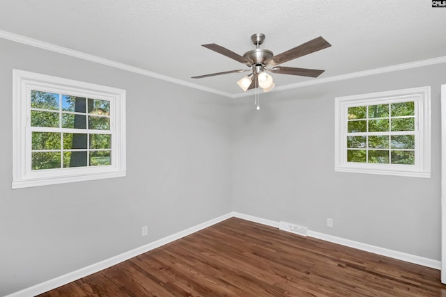 unfurnished room featuring crown molding, ceiling fan, dark wood-type flooring, and a wealth of natural light