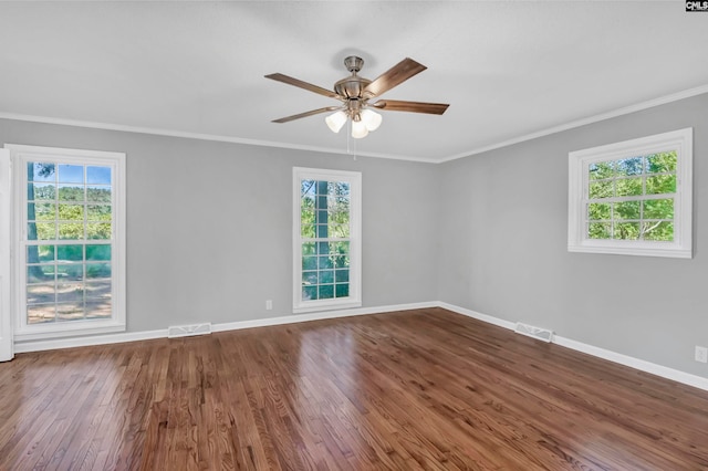 unfurnished room with ceiling fan, ornamental molding, plenty of natural light, and hardwood / wood-style floors