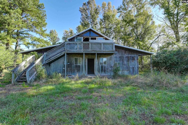 rear view of property with a deck