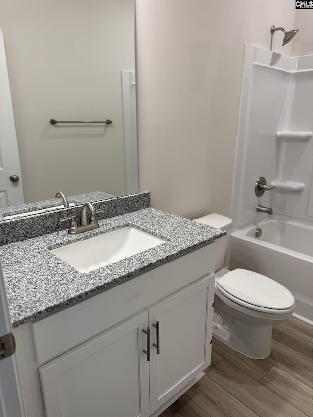 1282 Sessions Rd, Elgin, SC 29045 - bathroom with vanity, toilet, wood finished floors, and shower / bathtub combination