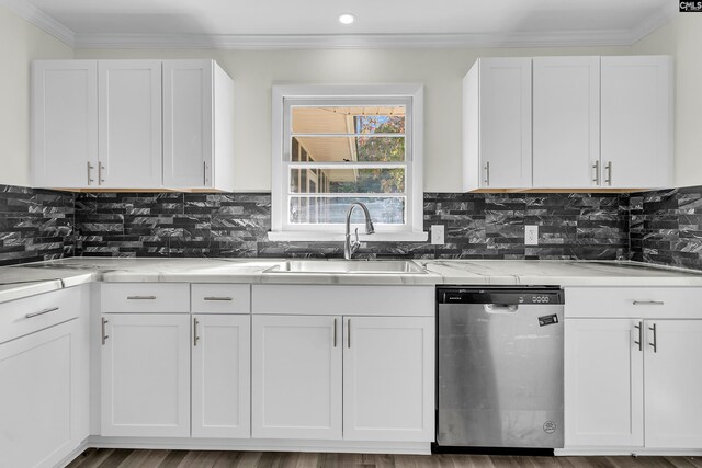 kitchen with sink, hardwood / wood-style flooring, white cabinetry, and dishwasher