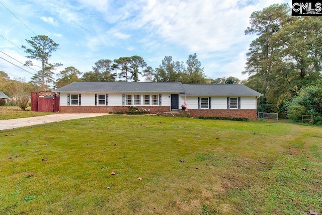 ranch-style home with a front lawn