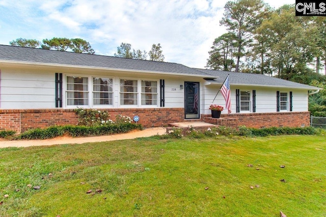 ranch-style home with a front yard