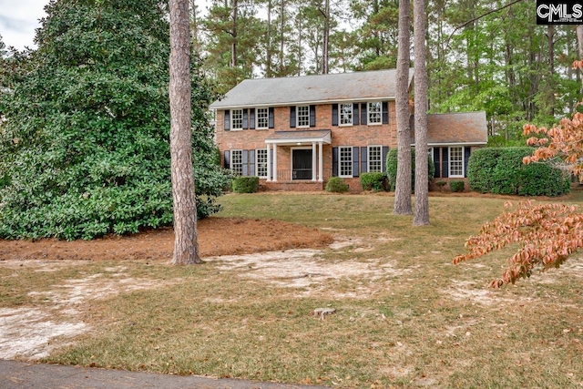 colonial inspired home with a front yard