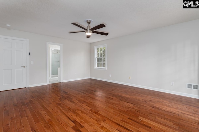 empty room with ceiling fan and hardwood / wood-style flooring