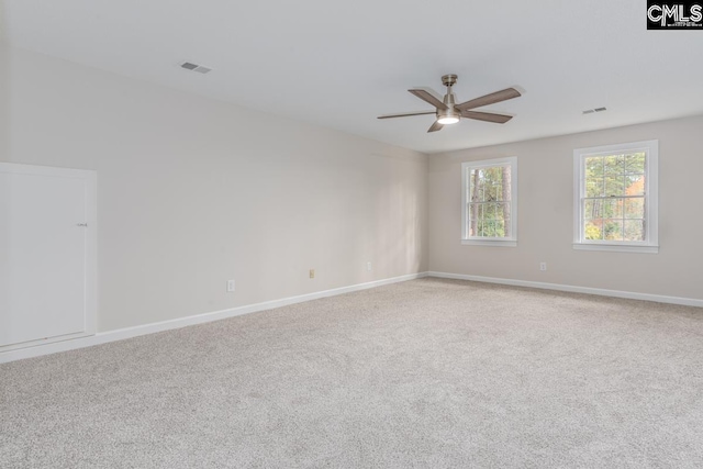 carpeted empty room with ceiling fan