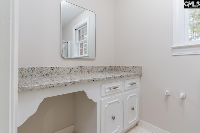 bathroom with vanity and tile patterned floors