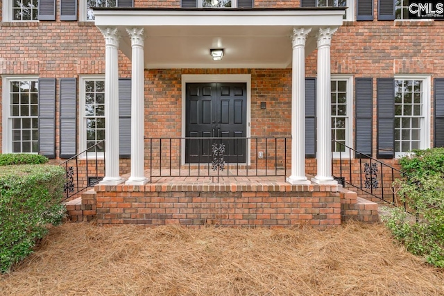 doorway to property featuring covered porch