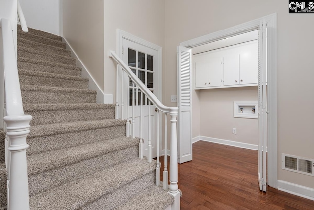 stairway featuring hardwood / wood-style flooring