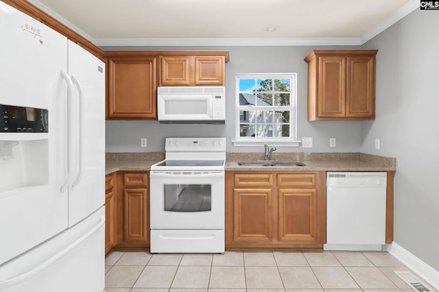 kitchen featuring ornamental molding, sink, white appliances, and light tile patterned floors