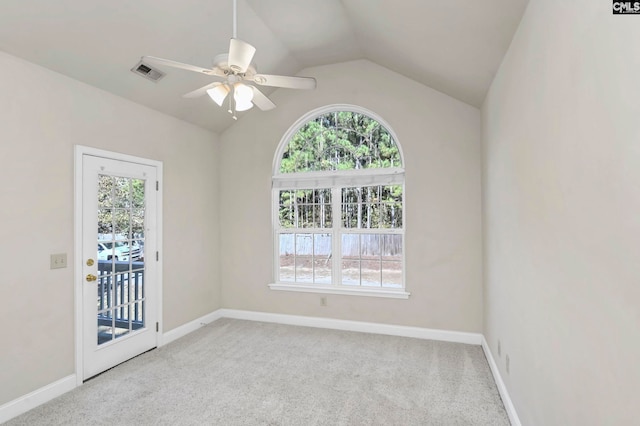 carpeted spare room with ceiling fan and lofted ceiling