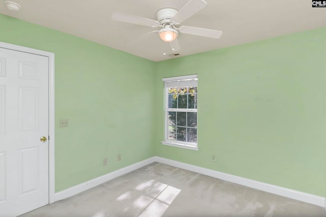 unfurnished room featuring ceiling fan and light colored carpet