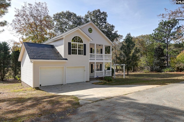 view of front property with a garage and a porch