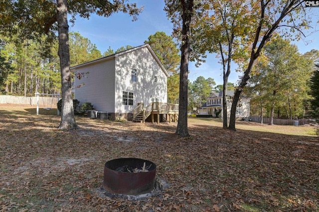 view of side of property featuring cooling unit and a deck