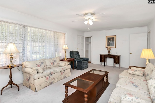 living room with ceiling fan and light colored carpet