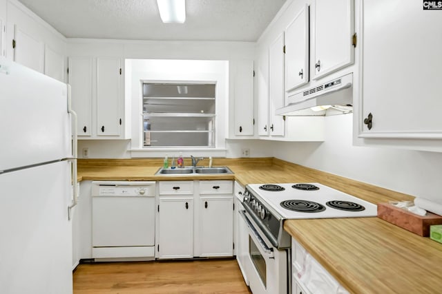 kitchen with white cabinetry, white appliances, sink, and light hardwood / wood-style floors