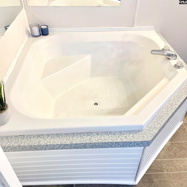 bathroom featuring a tub to relax in