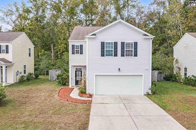 view of front of property featuring a garage and a front yard