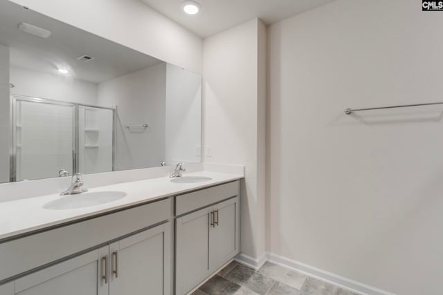 bathroom featuring walk in shower and vanity