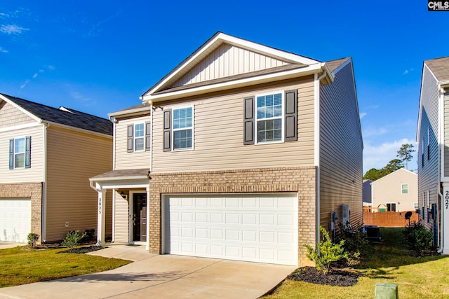 view of front of house with a garage and a front yard