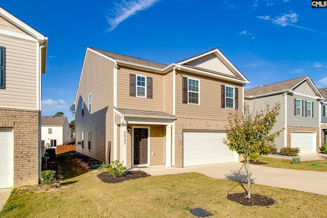 view of front of house with a garage and a front yard