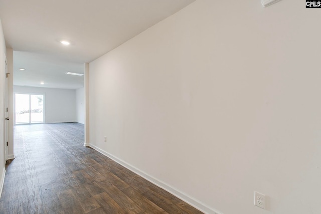 hallway with dark wood-type flooring