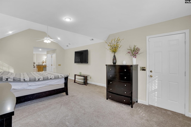 carpeted bedroom with vaulted ceiling and ceiling fan