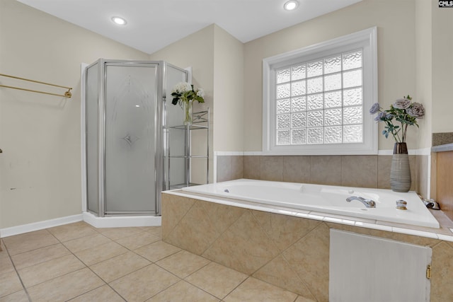 bathroom featuring tile patterned flooring and separate shower and tub