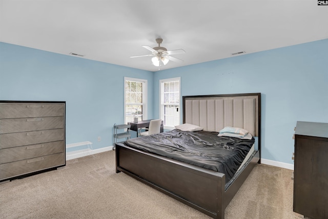 bedroom with light colored carpet and ceiling fan