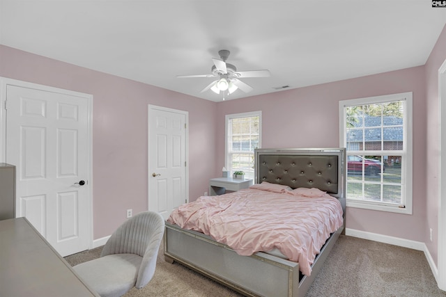 carpeted bedroom featuring ceiling fan