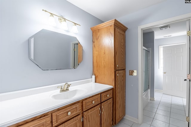 bathroom featuring vanity, bath / shower combo with glass door, and tile patterned floors