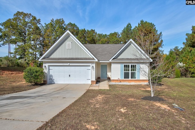 view of front of house featuring a garage and a front yard