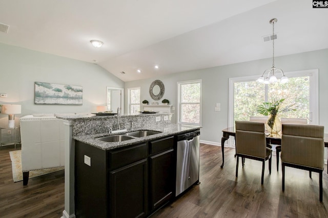 kitchen with dark hardwood / wood-style flooring, vaulted ceiling, dishwasher, sink, and an island with sink