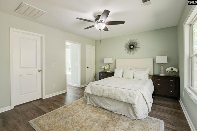 bedroom with dark wood-type flooring and ceiling fan