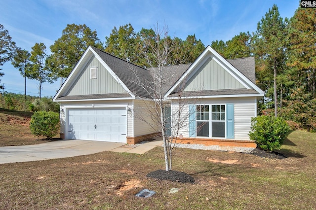 view of front of house with a garage and a front yard