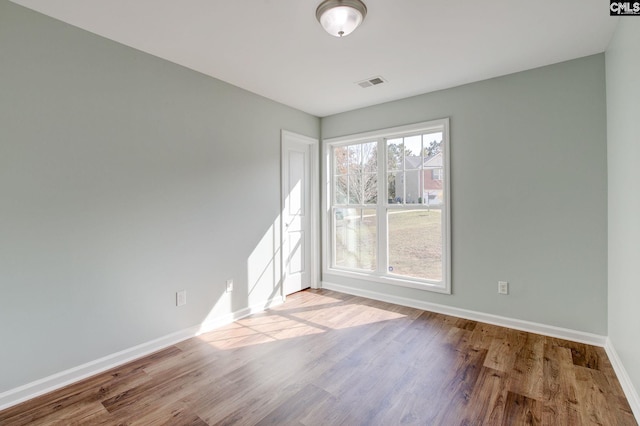 spare room featuring light wood-type flooring