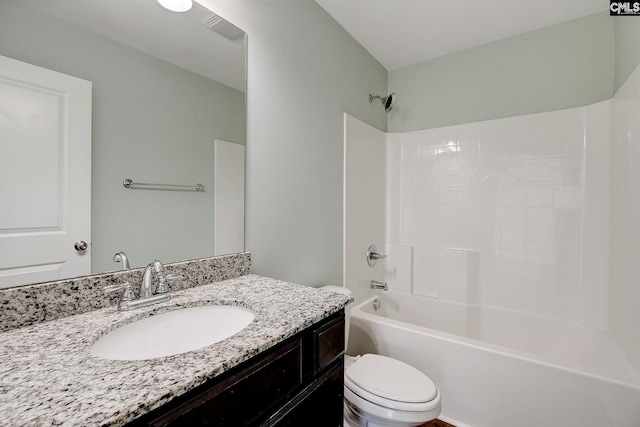 full bathroom featuring vanity, tub / shower combination, and toilet