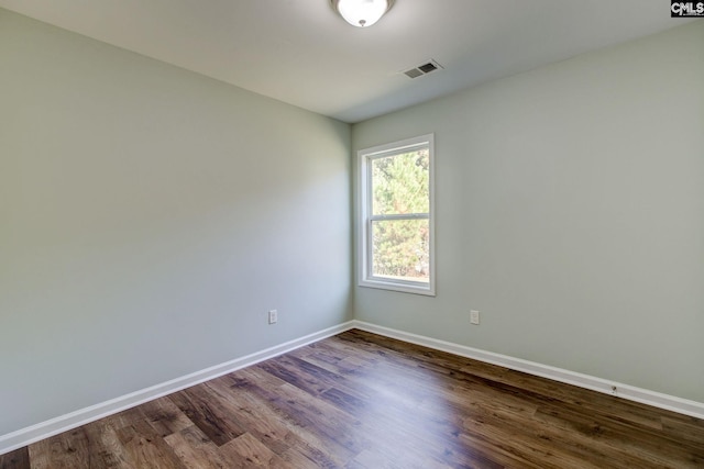 spare room featuring hardwood / wood-style flooring