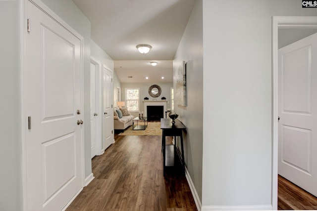 corridor with dark hardwood / wood-style floors