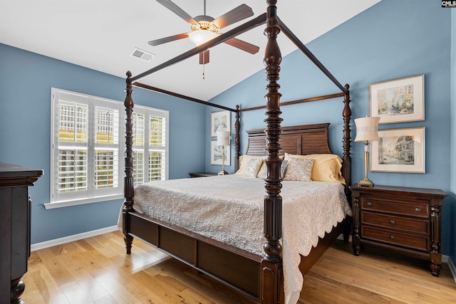 bedroom featuring ceiling fan, light hardwood / wood-style flooring, and vaulted ceiling