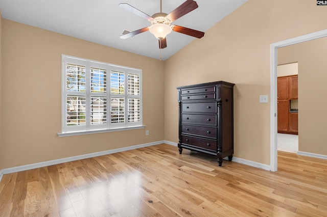 unfurnished bedroom featuring ceiling fan, light hardwood / wood-style flooring, and vaulted ceiling