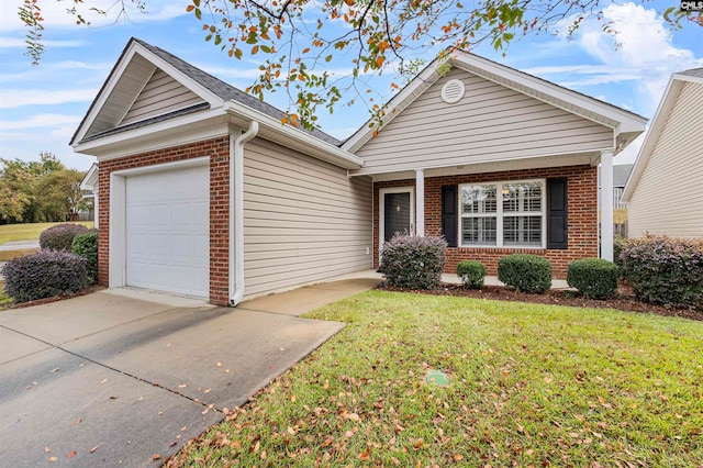 view of front of home with a garage and a front yard