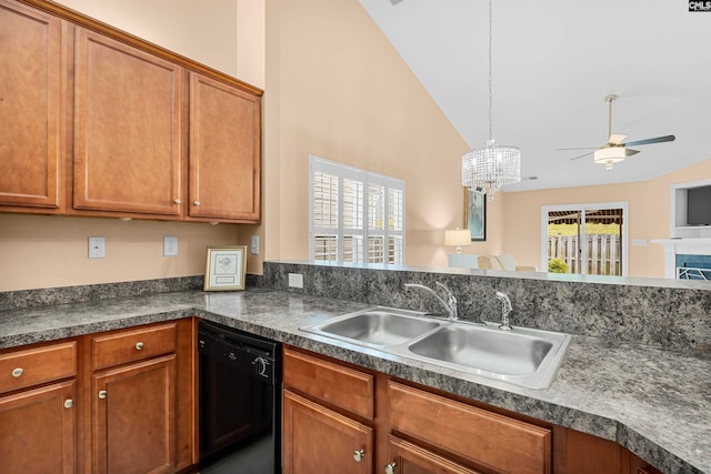 kitchen featuring ceiling fan with notable chandelier, black dishwasher, hanging light fixtures, sink, and high vaulted ceiling