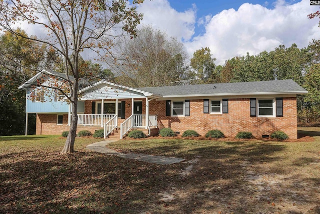 view of front facade with a porch and a front lawn