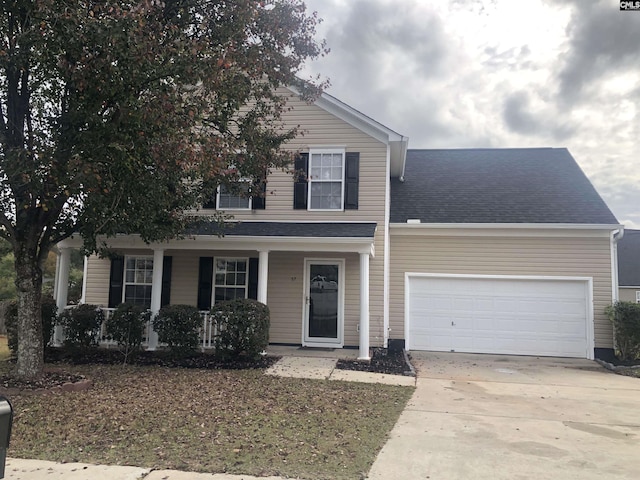 front of property featuring a garage and a porch