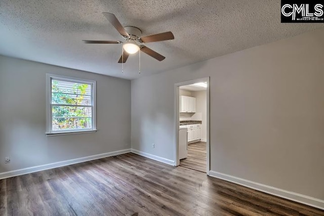 2230 Corning Rd, Columbia, SC 29205 - empty room featuring ceiling fan, a textured ceiling, dark wood-style flooring, and baseboards