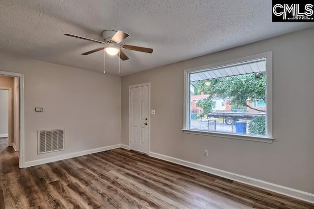 2230 Corning Rd, Columbia, SC 29205 - entryway with wood finished floors, a textured ceiling, a ceiling fan, and baseboards