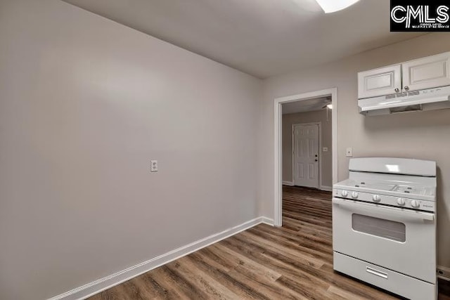 2230 Corning Rd, Columbia, SC 29205 - kitchen with white range with gas stovetop, under cabinet range hood, white cabinets, wood finished floors, and baseboards